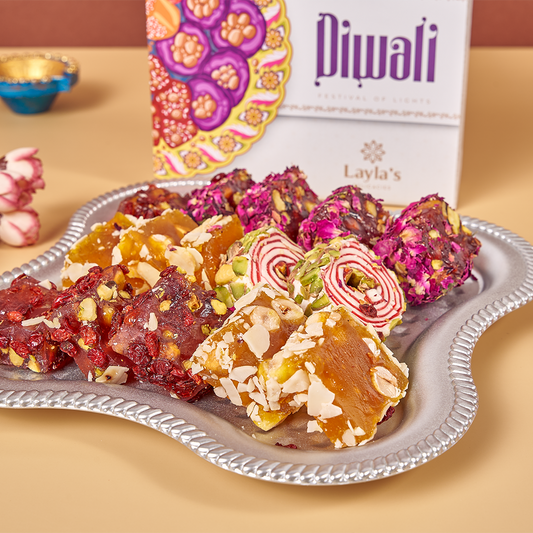 Close-up of vegan Lokum pieces from Diwali Lokum Special box, highlighting texture and colors of the pieces inside such as Orange Hazelnut, Pomegranate Pistachio, Rose Pomegranate Pistachio, Sesame Hazelnut, and Pistachio
