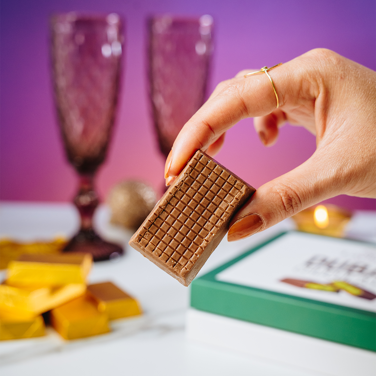 Hand holding Valentine's Dubai Chocolate piece