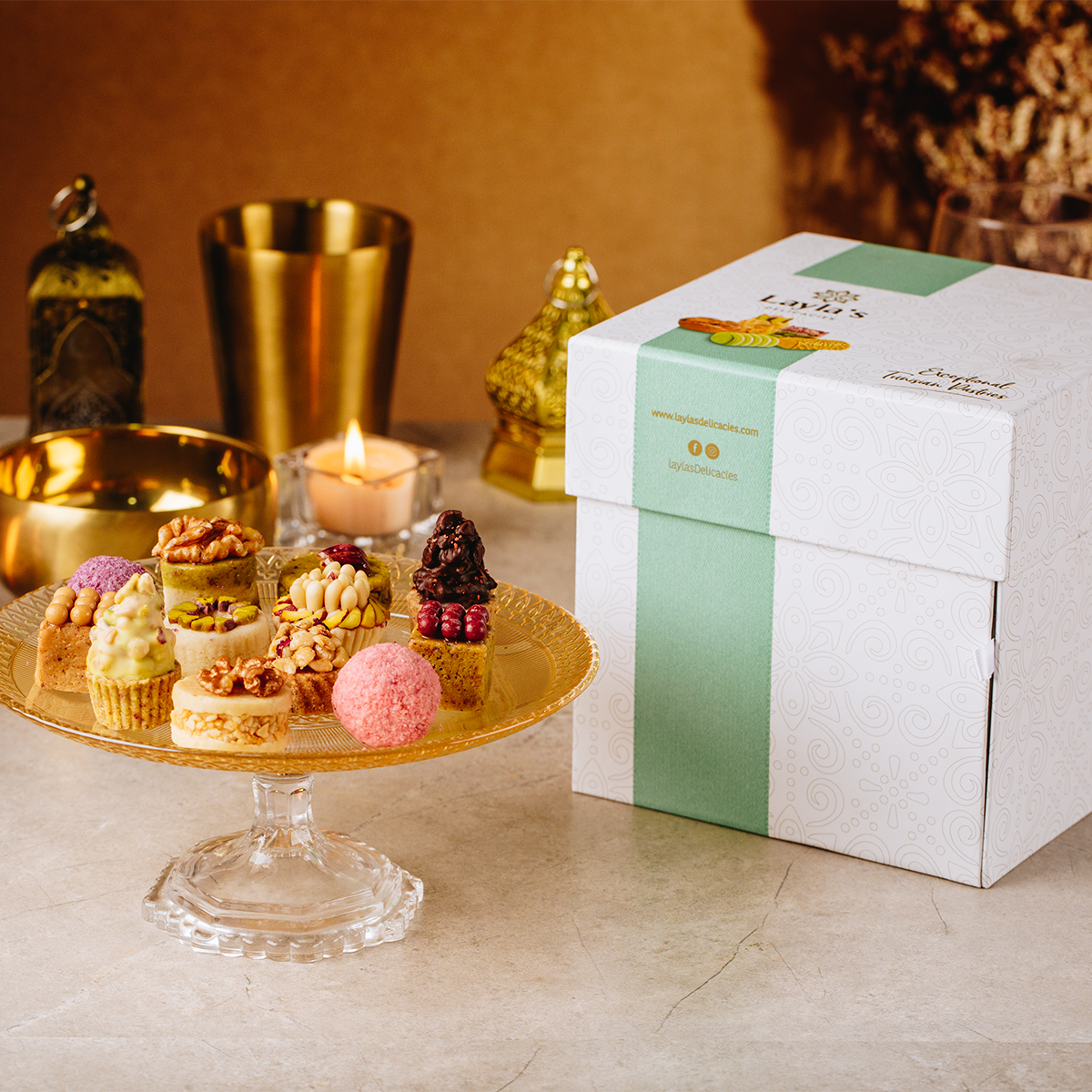 Layla's Delicacies 46 pieces Appreciation gift box presented on a counter next to the handmade sweets on a plate