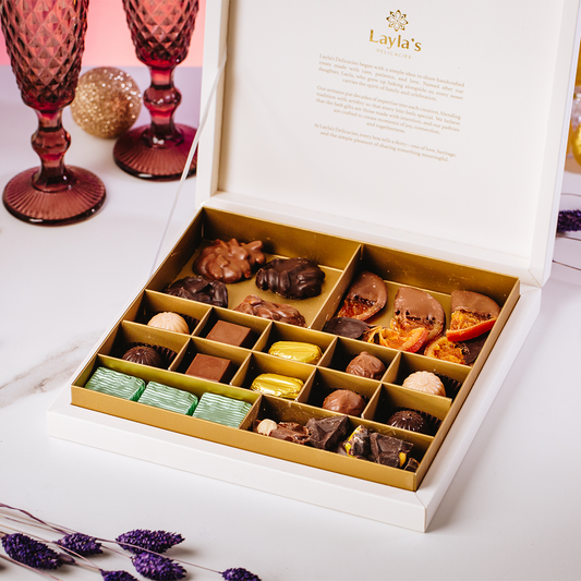 Open box of assorted chocolates of the Layla's Delicacies Valentine's gift box with Layla's emotional message written inside