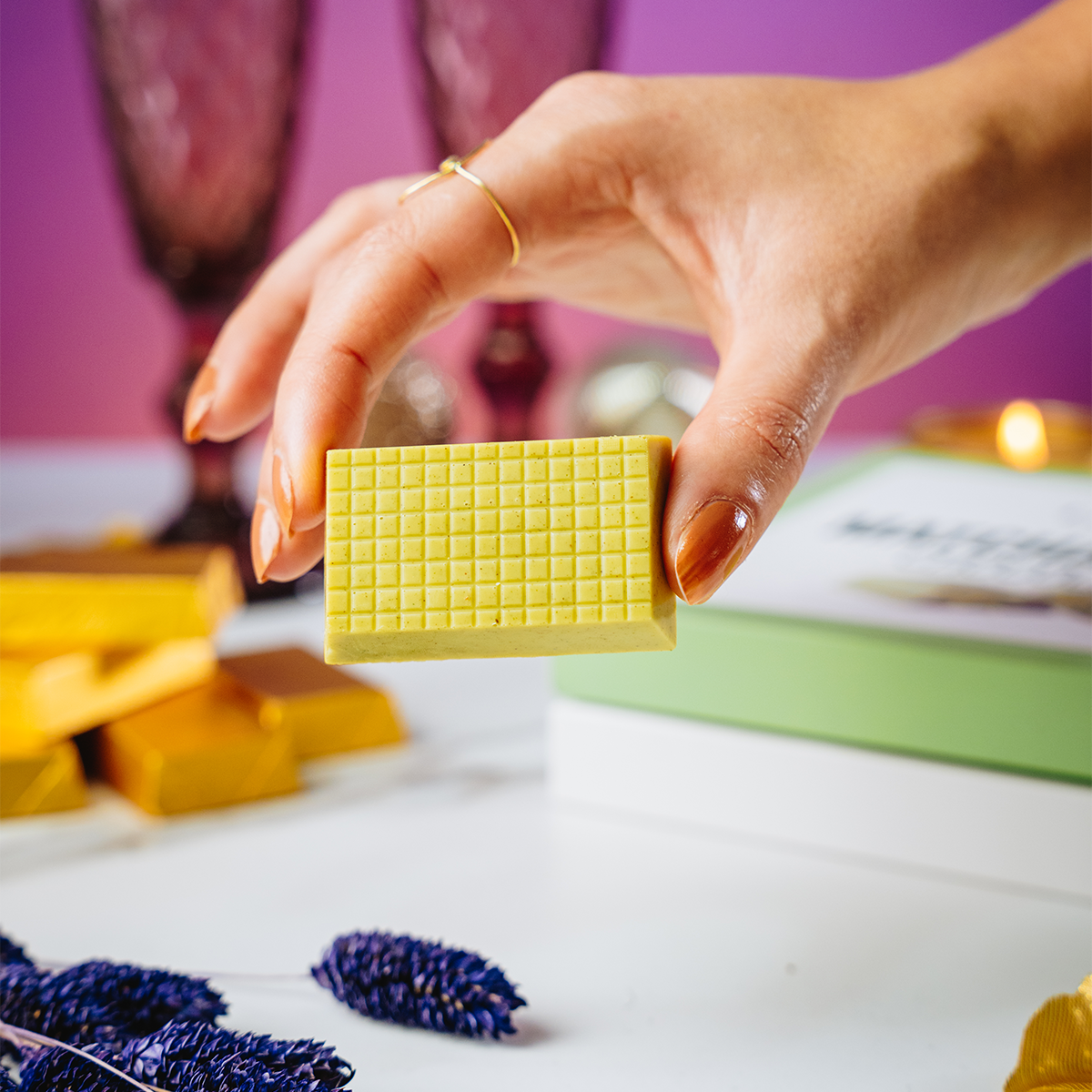 Hand holding Valentine's Matcha Dubai Chocolate piece