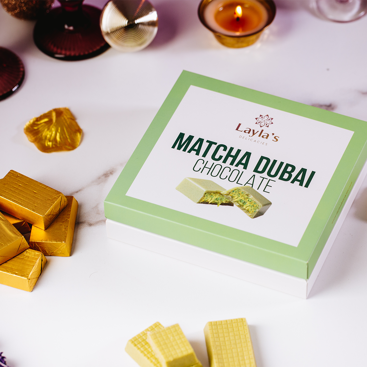 Valentine's gift Box of Layla's Matcha Dubai Chocolate with chocolate bars on a white surface 
