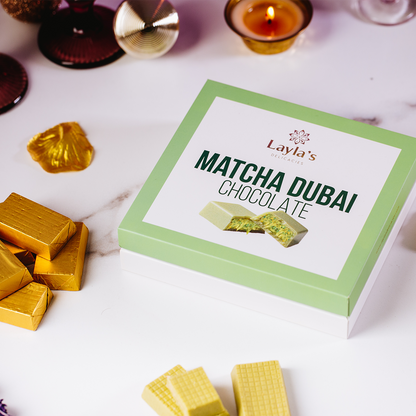 Valentine's gift Box of Layla's Matcha Dubai Chocolate with chocolate bars on a white surface 